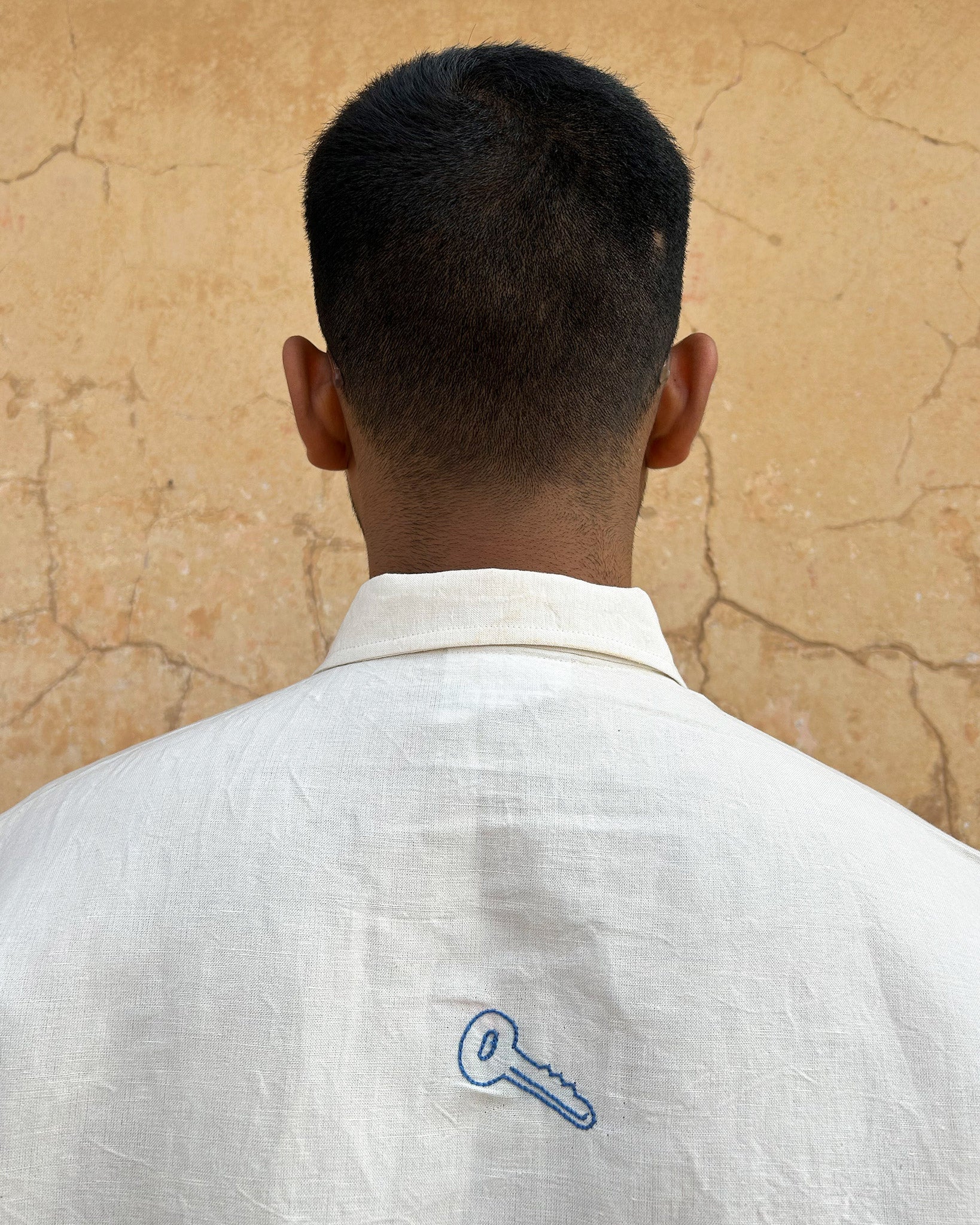 Clearly Confused White Shirt with Blue Embroidery Back Collar