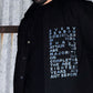 Model wearing Majority Act Black Shirt with Embroidered Text